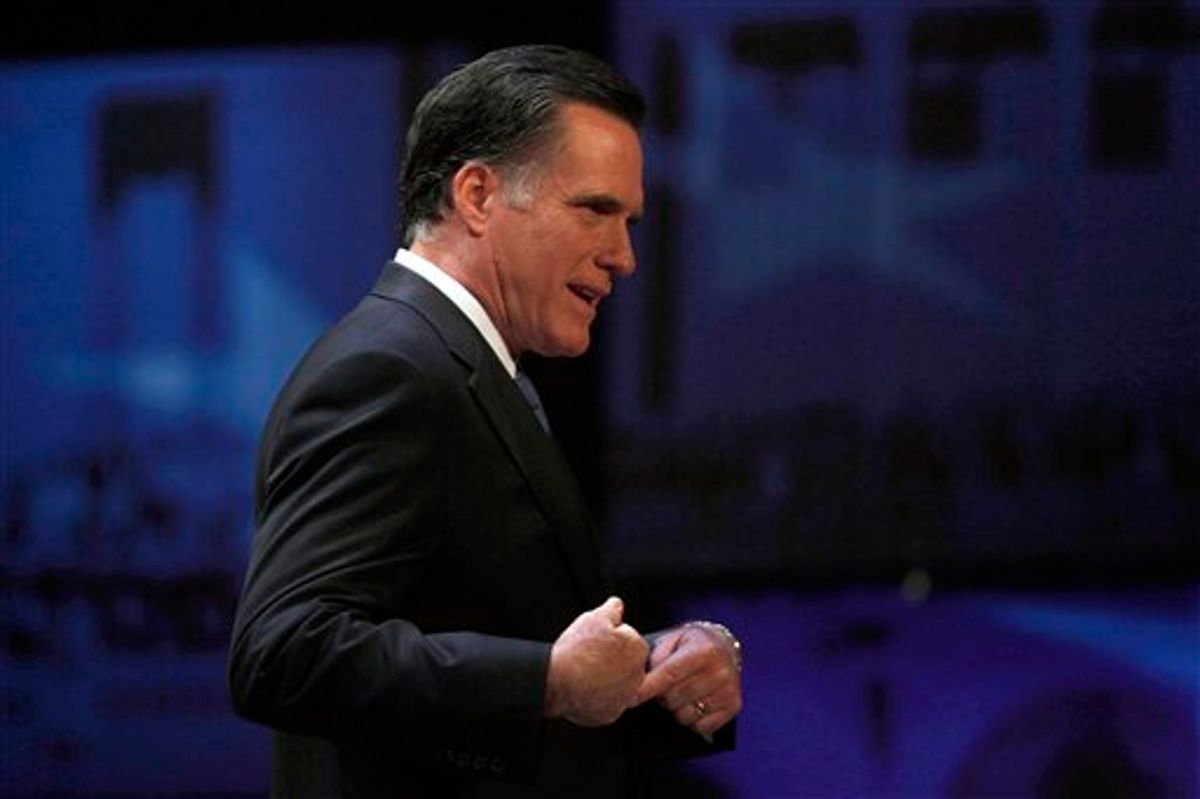 Former Massachusetts Gov. Mitt Romney reacts as he walks off the stage after a Republican presidential candidate debate at the Capitol Center for the Arts in Concord, N.H., Sunday, Jan. 8, 2012. (AP Photo/Charles Krupa)    (AP)