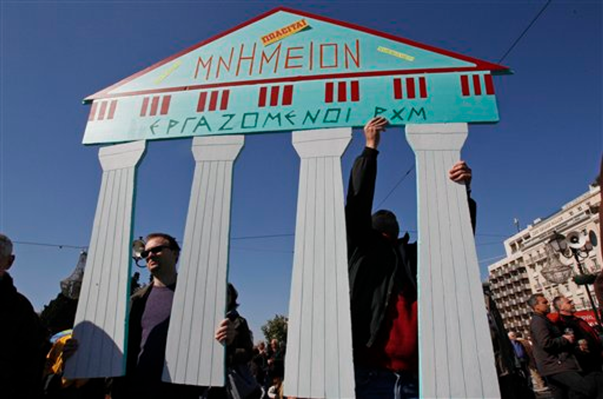 Employees of the Byzantine and Christianity museum hold a cardboard replica of ancient ruins which reads: ''Monument for sale'' during a peaceful protest outside the Greek Parliament in Athens, Sunday, Feb. 19, 2012        (AP Photo/Thanassis Stavrakis)