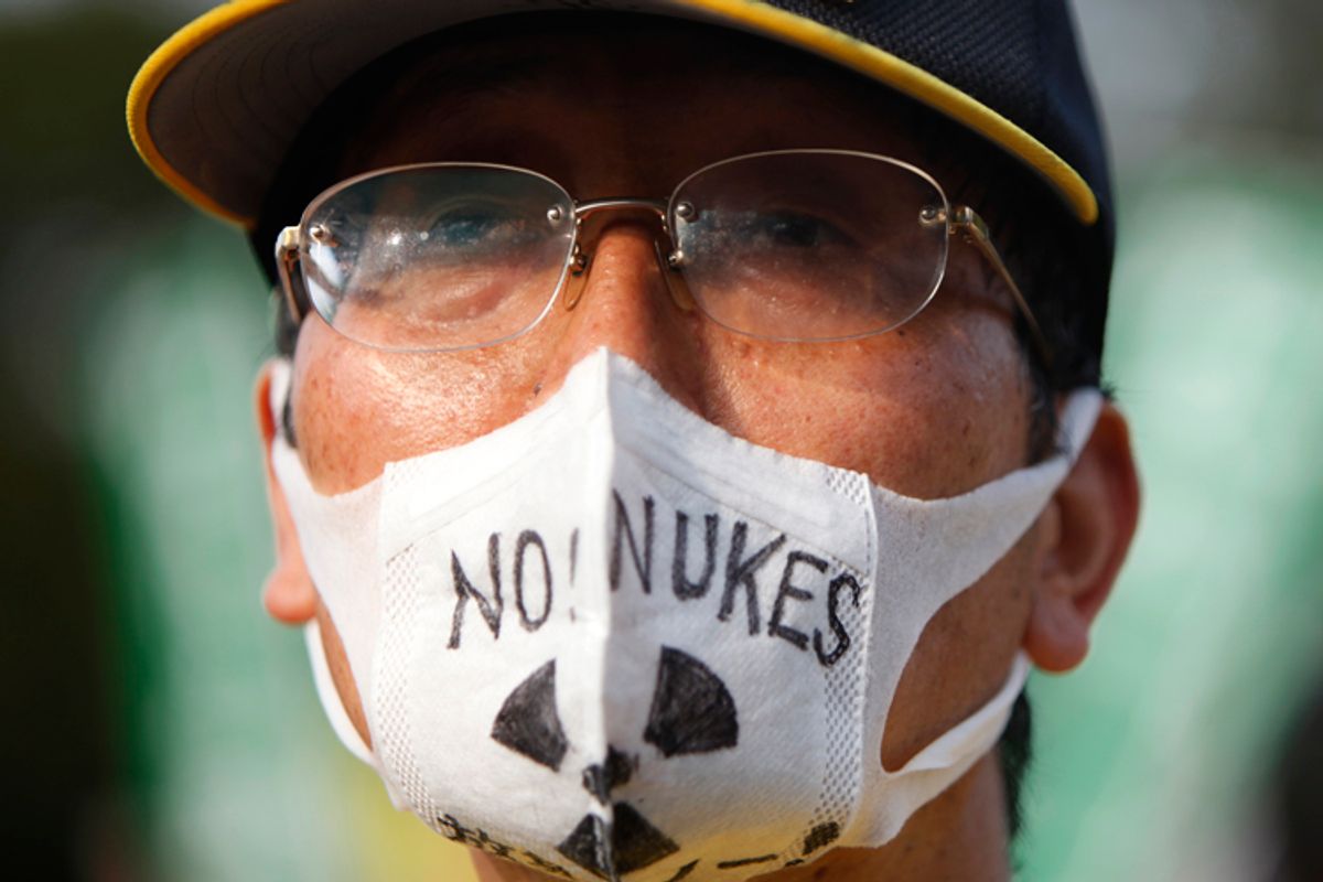 A man wearing a mask attends an anti-nuclear rally in Tokyo September 19, 2011.              (Yuriko Nakao / Reuters)