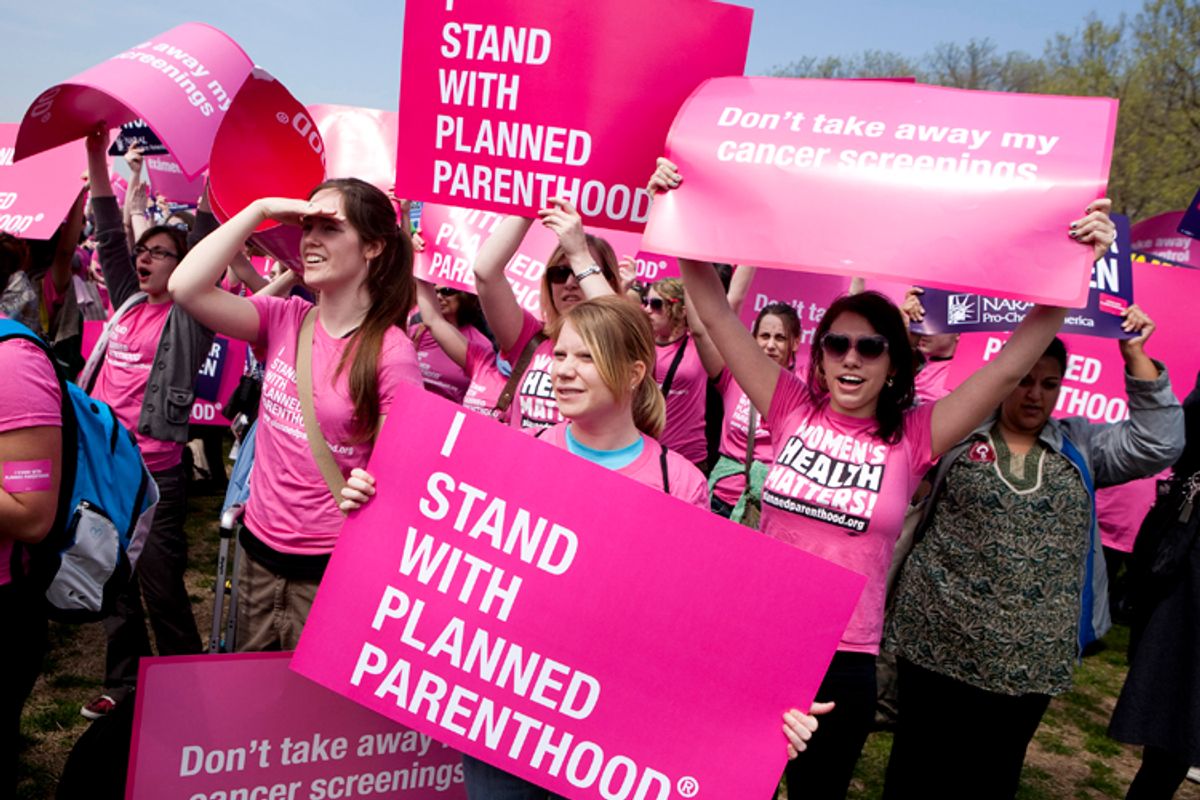 Members of Planned Parenthood, NARAL Pro-Choice America and more than 20 other organizations hold a "Stand Up for Women's Health" rally in supporting preventive health care and family planning services, including abortion in Washington April 7, 2011.      (Reuters/Joshua Roberts)