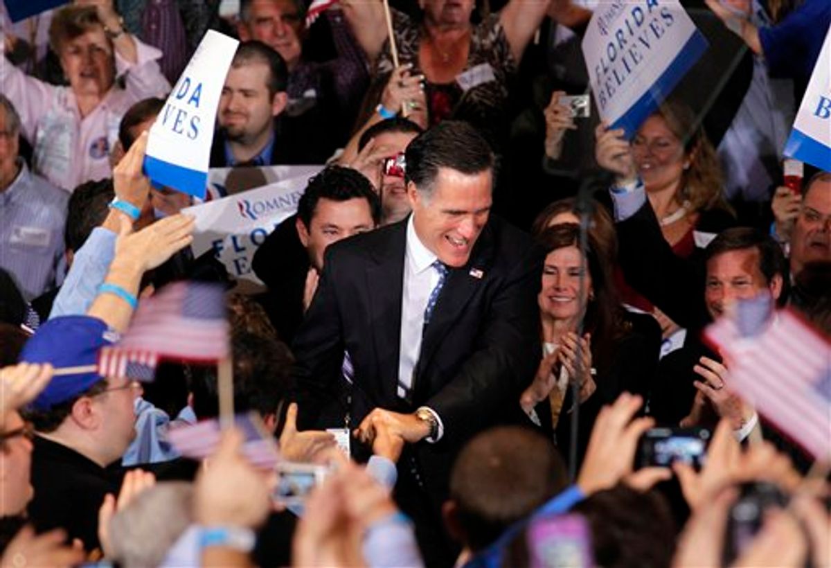 Republican presidential candidate, former Massachusetts Gov. Mitt Romney, greets supporters at his Florida primary primary night rally in Tampa, Fla., Tuesday, Jan. 31, 2012. (AP Photo/Gerald Herbert)        (AP)