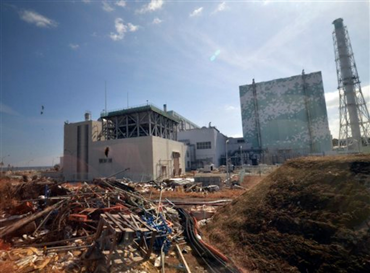 Debris is seen scattered near the Unit 6 reactor building of stricken Fukushima Dai-ichi nuclear power plant in Okuma town, Fukushima prefecture, northeastern Japan Tuesday, Feb. 28, 2012         (AP/Yoshikazu Tsuno, Pool)