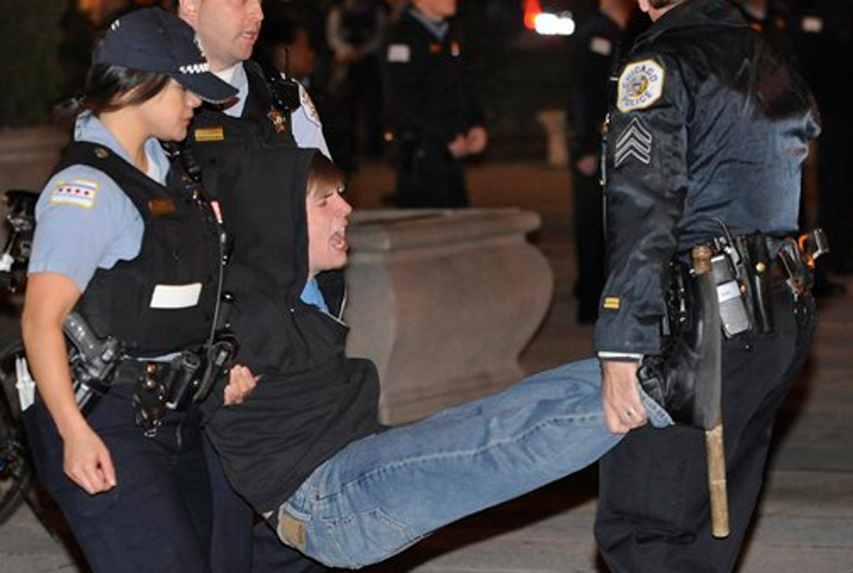 In this Oct. 23, 2011 file photo, a protester gets arrested during an Occupy Chicago march and protest in Grant Park in Chicago.   (AP Photo/Paul Beaty,File)