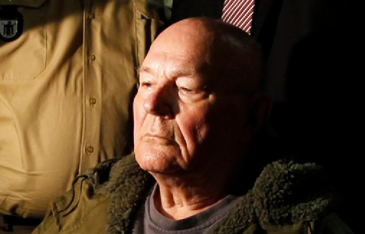 John Demjanjuk waits in a courtroom in Munich. He was charged with 28,060 counts of accessory to murder and convicted of serving as a Nazi death camp guard.       (AP Photo/Matthias Schrader)