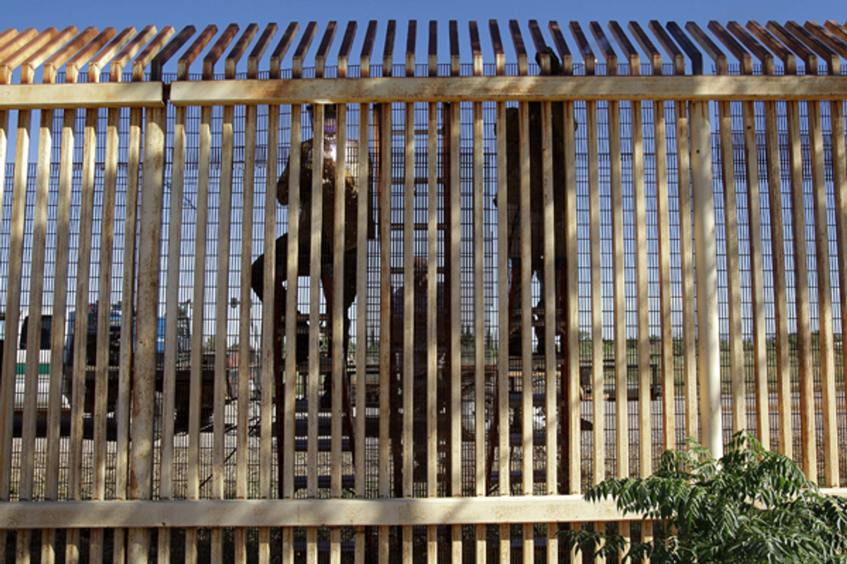  In this Sept. 27, 2010 photo, contractors reinforce a section of damaged border fence as seen from Sonora, Mexico     (AP/Matt York)