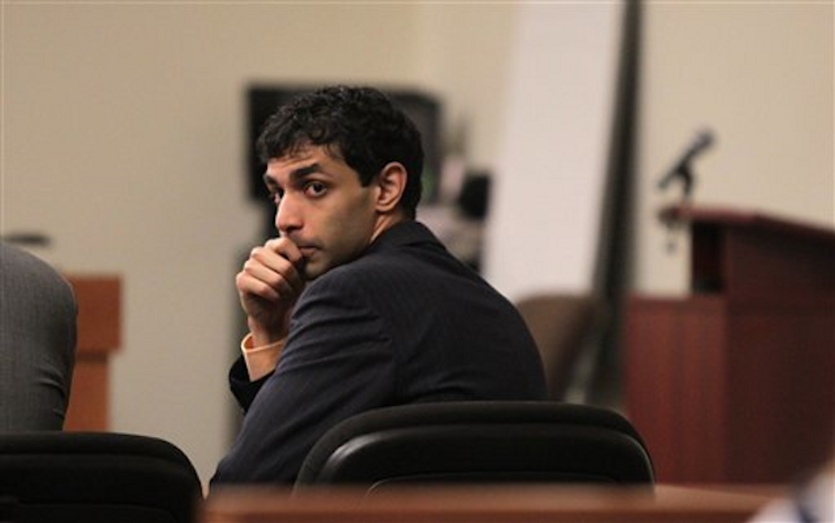  Dharun Ravi waits for the judge to explain the law to the jury before they begin their deliberations during his trial at the Middlesex County Courthouse in New Brunswick, N.J. on Wednesday, March 14, 2012         (AP Photo/The Star-Ledger, John O'Boyle, Pool)