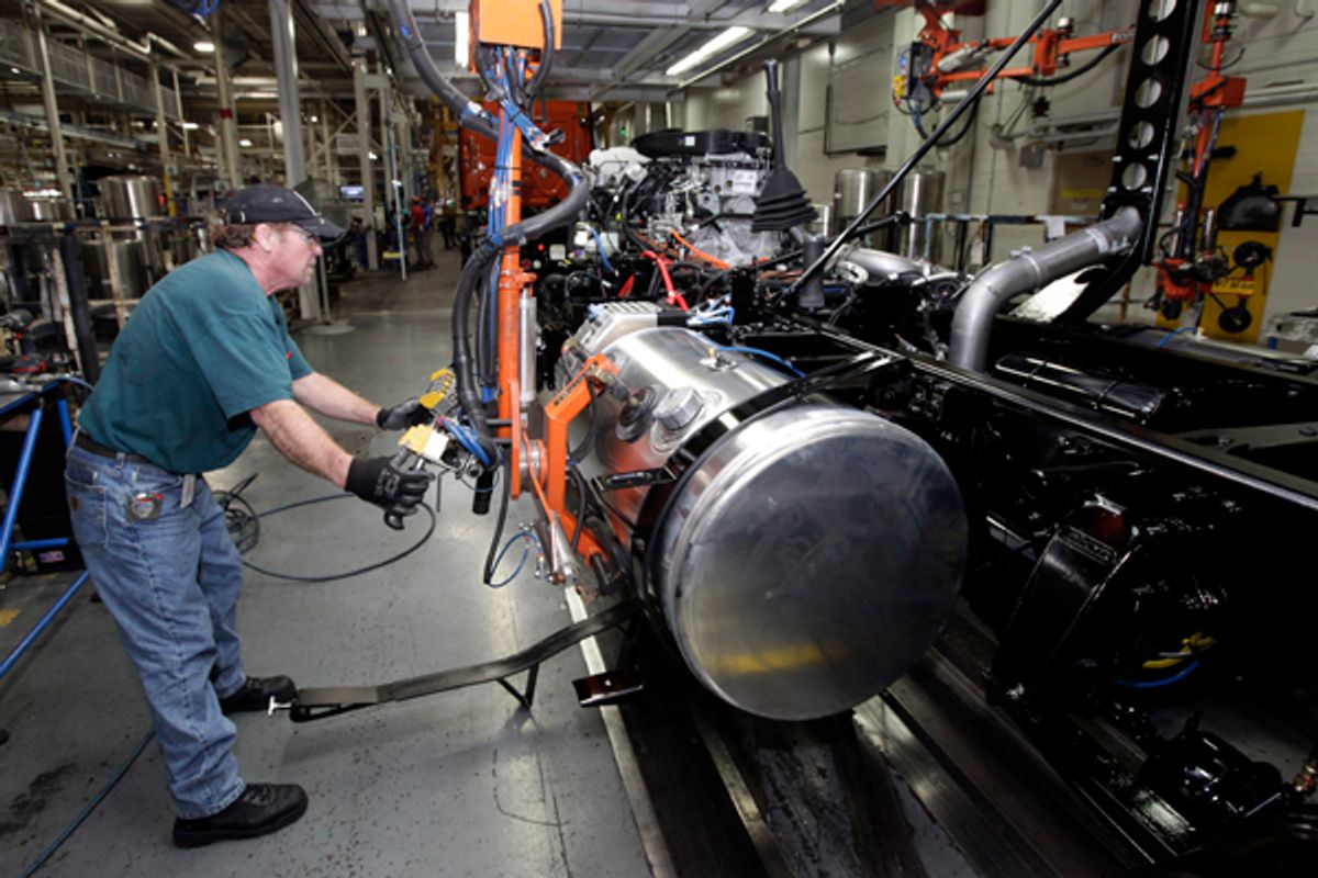 Thomas Warren installs a fuel cell on a Freightliner truck at a plant in Cleveland, N.C.     (AP/Chuck Burton)