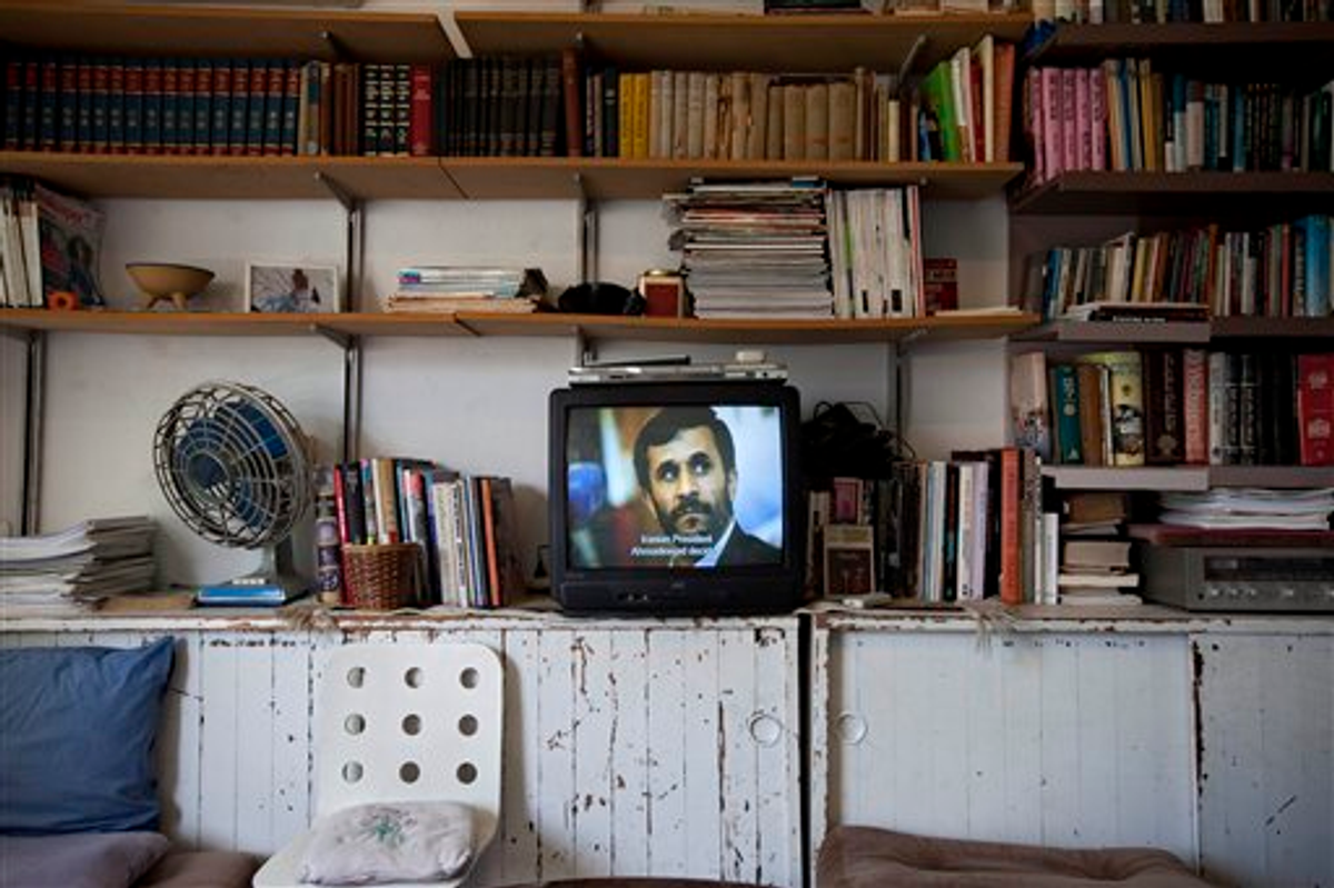 A video art work displays Iranian President Mahmoud Ahmadinejad at a gallery in Tel Aviv, Israel                  (AP Photo/Oded Balilty)