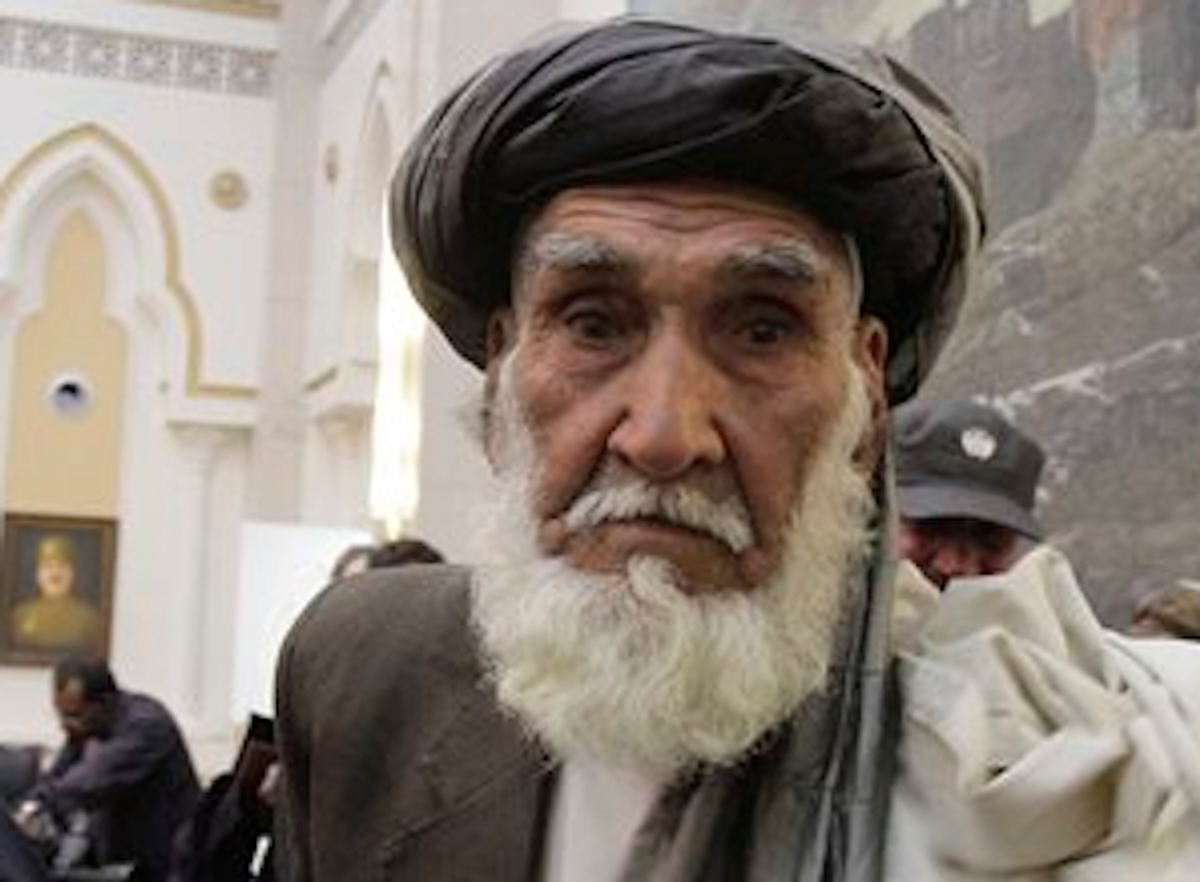  In this Friday, March 16, 2012 photo, Ghulam Rasool, a tribal elder from Panjwai district of Kandahar province, leaves the hall after a meeting with Afghan President Hamid Karzai    (AP Photo/Ahmad Jamshid)