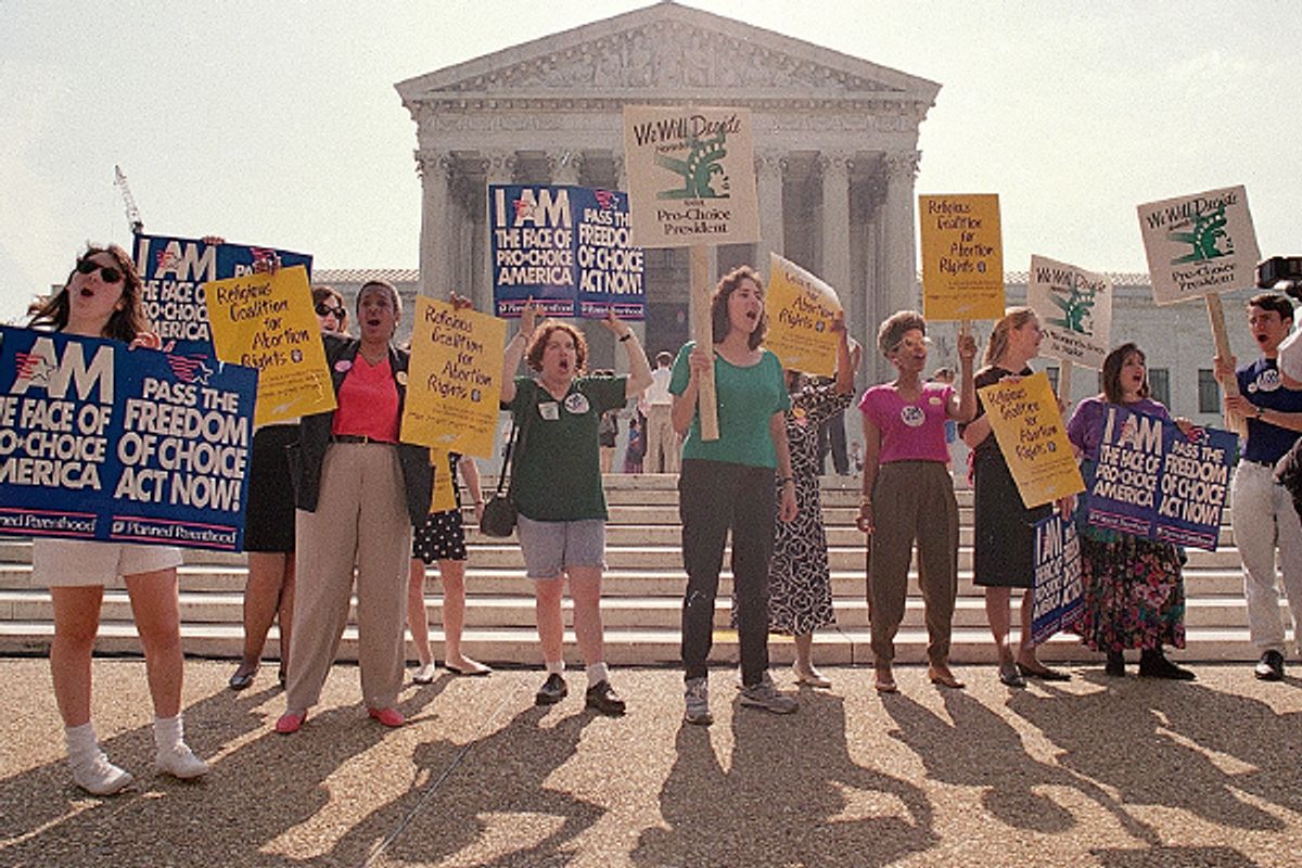 Pro-choice advocates gather outside the Supreme Court on June 26, 1992, awaiting the court's decision on Pennsylvania's abortion restrictions.     (AP/Barry Thumma)