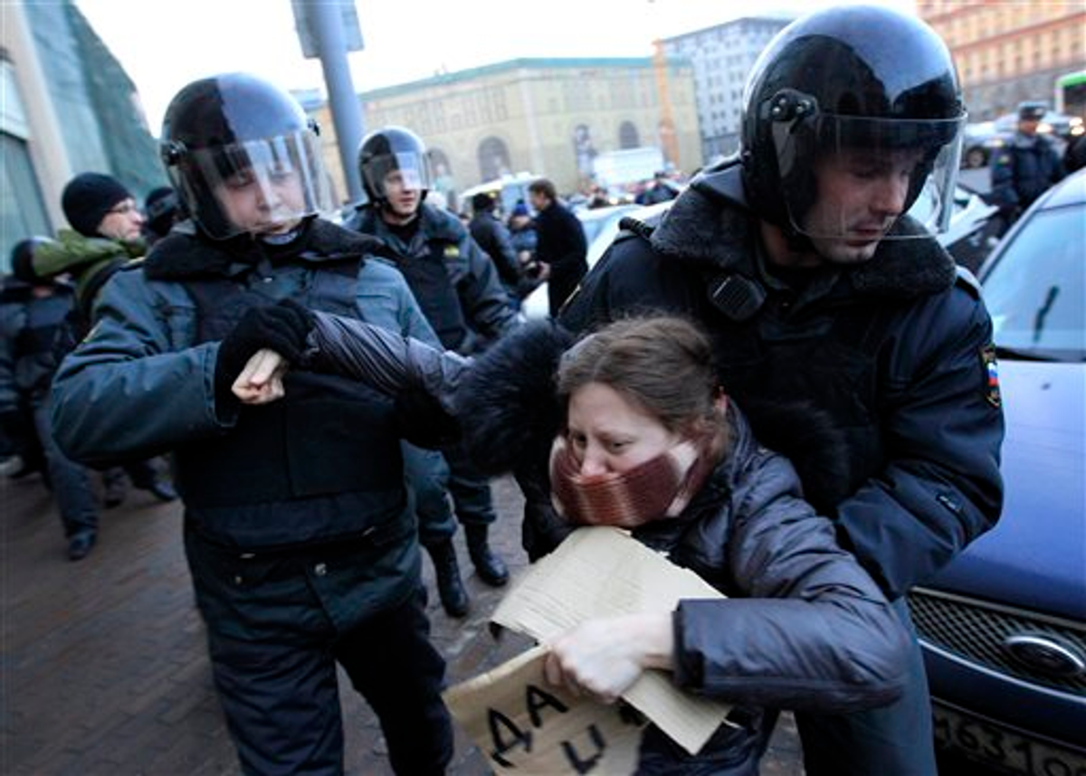  Russian police officers detain an opposition protester during a protest near the Central Election Committee in Moscow, Monday, March, 5, 2012  (AP Photo/Sergey Ponomarev)