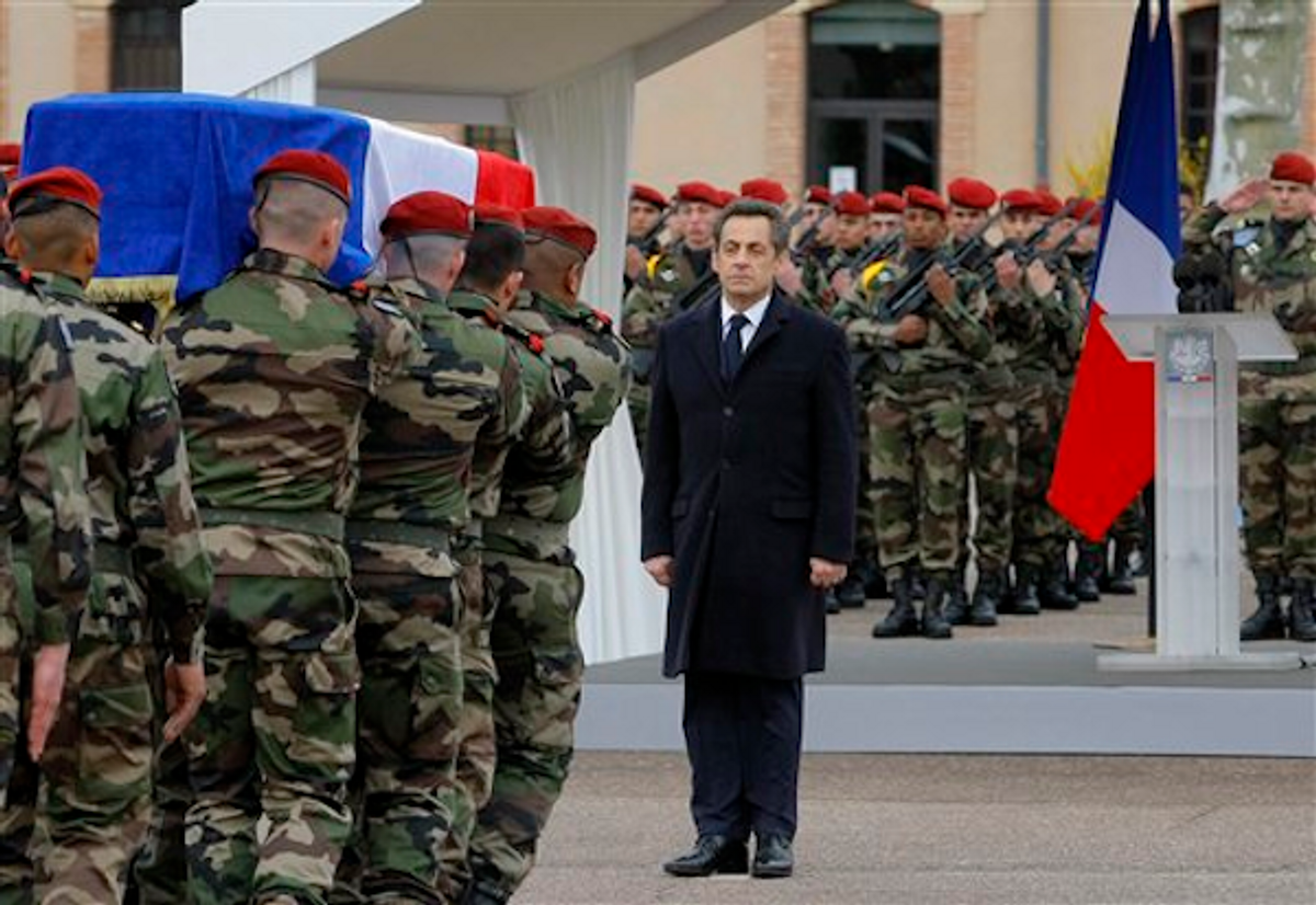 French President Nicolas Sarkozy stands by soldiers carrying a coffin during a ceremony honoring the three soldiers killed by a suspect identified as Mohammad Merah, who is also suspected in the killings of three Jewish children and a rabbi, Wednesday, March 21, 2012 in Montauban, southwestern France      (AP Photo/Jacques Brinon)