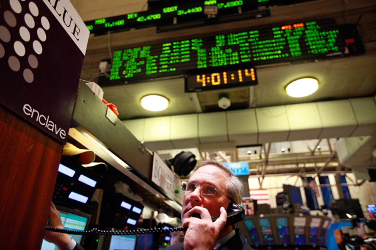 A trader looks up at the board just after the closing bell on the floor of the New York Stock Exchange, February 27, 2012.   (Reuters/Brendan McDermid)