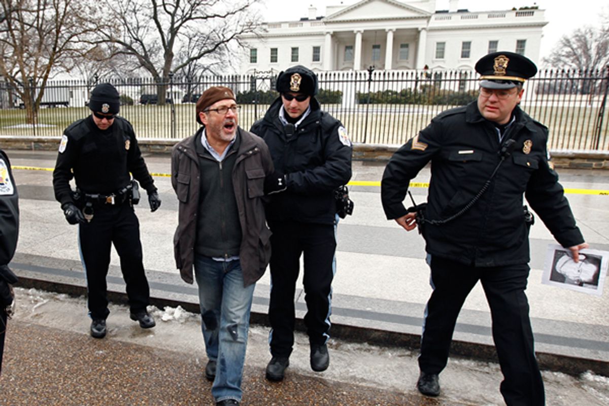 A protester is arrested at the White House in January, 2011.  (AP/Kevin Lamarque)