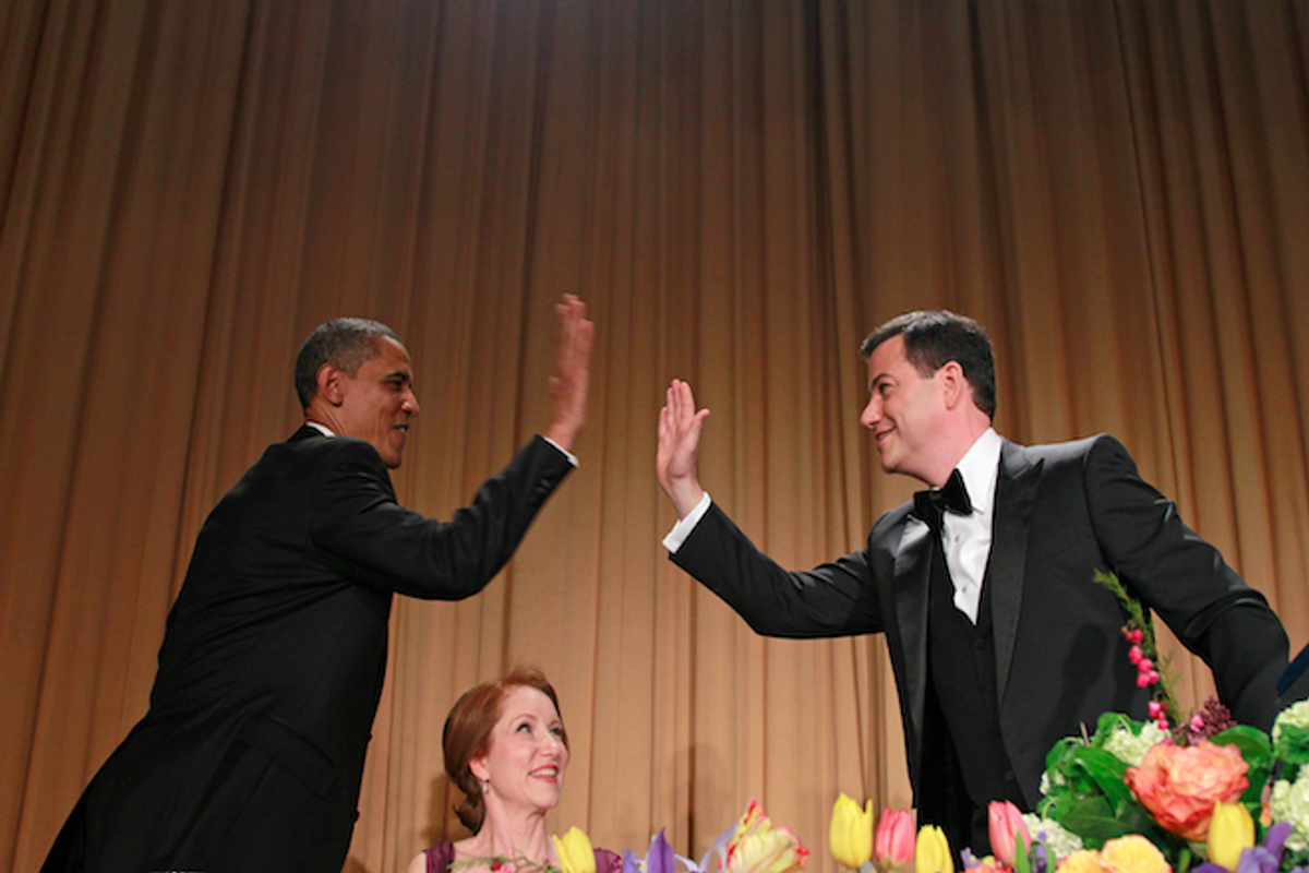President Barack Obama high-fives Jimmy Kimmel as Caren Bohan, a Reuters journalist and president of the White House Correspondents' Association, looks on, Saturday, April 28, 2012 (AP/Haraz N. Ghanbari)