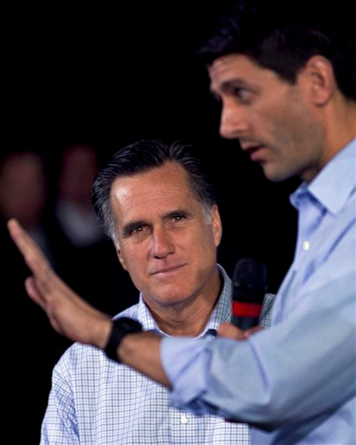 Republican presidential candidate, former Massachusetts Gov. Mitt Romney,  left, watches as U.S. Rep. Paul Ryan, R-Wis., Chairman of the House Budget Committee, right, addresses an audience during a Romney campaign event at an oil company in Milwaukee, Monday, April 2, 2012. (AP Photo/Steven Senne)               (AP)