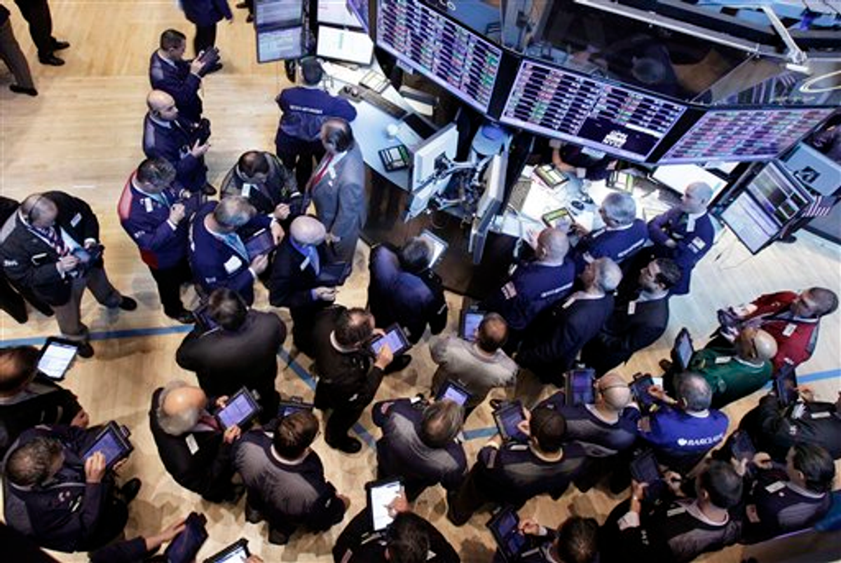  Traders gather at the post that handles Global Payments Inc. on the floor of the New York Stock Exchange (AP/Richard Drew)