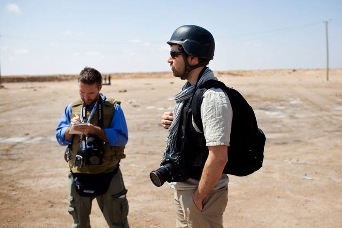  The author with his friend Chris Hondros, right, who died in Libya in 2011.     (Nicole Tung)
