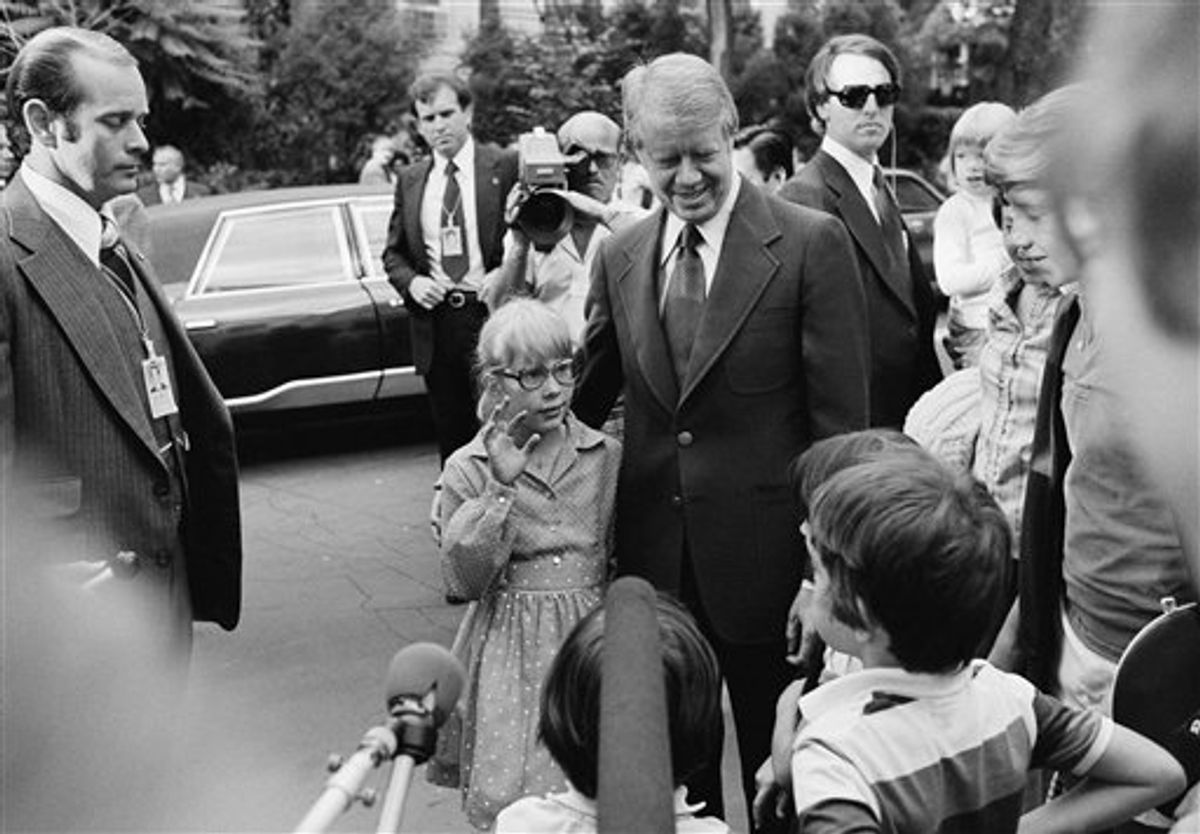 FILE - In this June 8, 1977 file photo, President Jimmy Carter stands with his daughter Amy as she waves to other children on the street in the Georgetown section of Washington, guarded by Secret Service agents. Carter went to Georgetown to dine at the home of Management and Budget Director Bert Lance. The Secret Service has been tarnished by a prostitution scandal that erupted April 13, 2012 in Colombia involving 12 Secret Service agents, officers and supervisors and 12 more enlisted military personnel ahead of President Barack Obama's visit there for the Summit of the Americas. (AP Photo/Barry Thumma)      (AP)