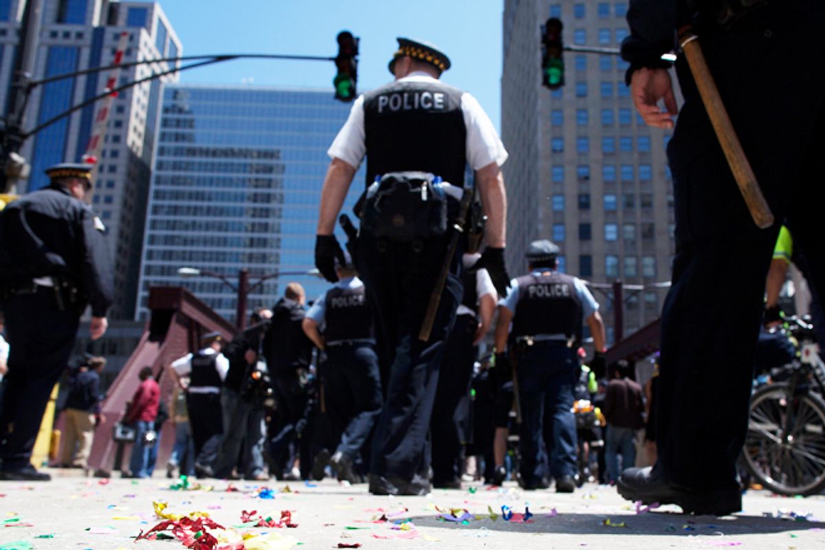 Chicago police officers walk away from an anti-NATO protest march on Monday.      (Reuters/Andrew Kelly)