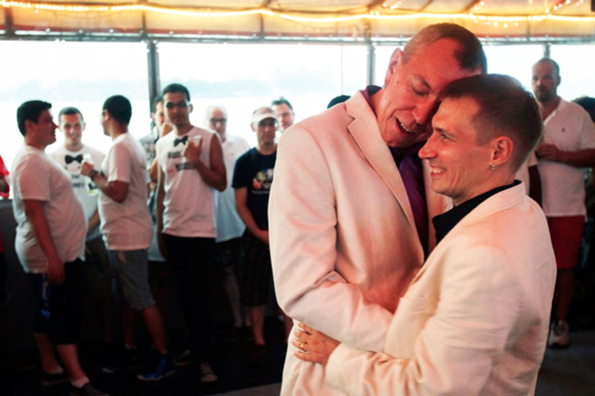 David Hind, left, and Craig Francisco dance their first dance after getting married on a cruise hosted by Marriage Equality New York, soon after gay marriage was legalized in the state.       (AP/Seth Wenig)