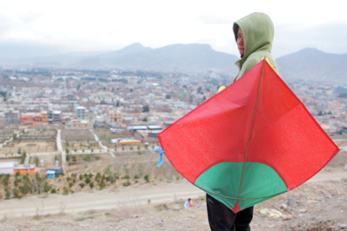 A child flies a kite in Kabul on Tuesday Mar. 27, 2012.     (Geoffrey Ingersoll)