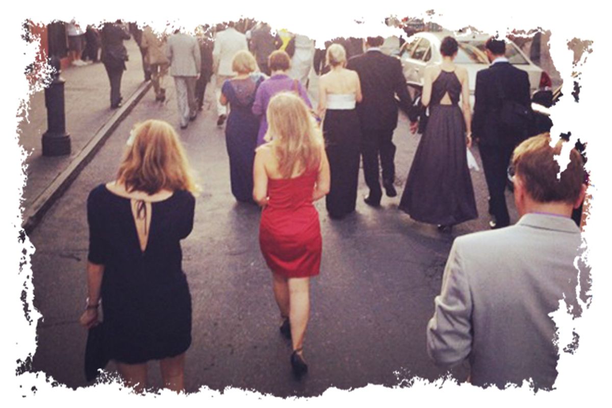The author in a red dress in a Second Line processional
through the French Quarter.       (Laurence Kretchmer)