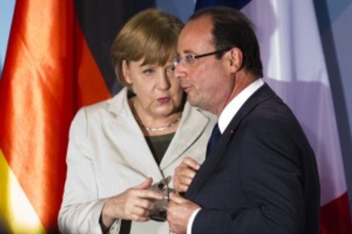 In this May 15, 2012 file photo, German Chancellor Angela Merkel, left, talks to new French President Francois Hollande in Berlin.          (AP Photo/Markus Schreiber, File)