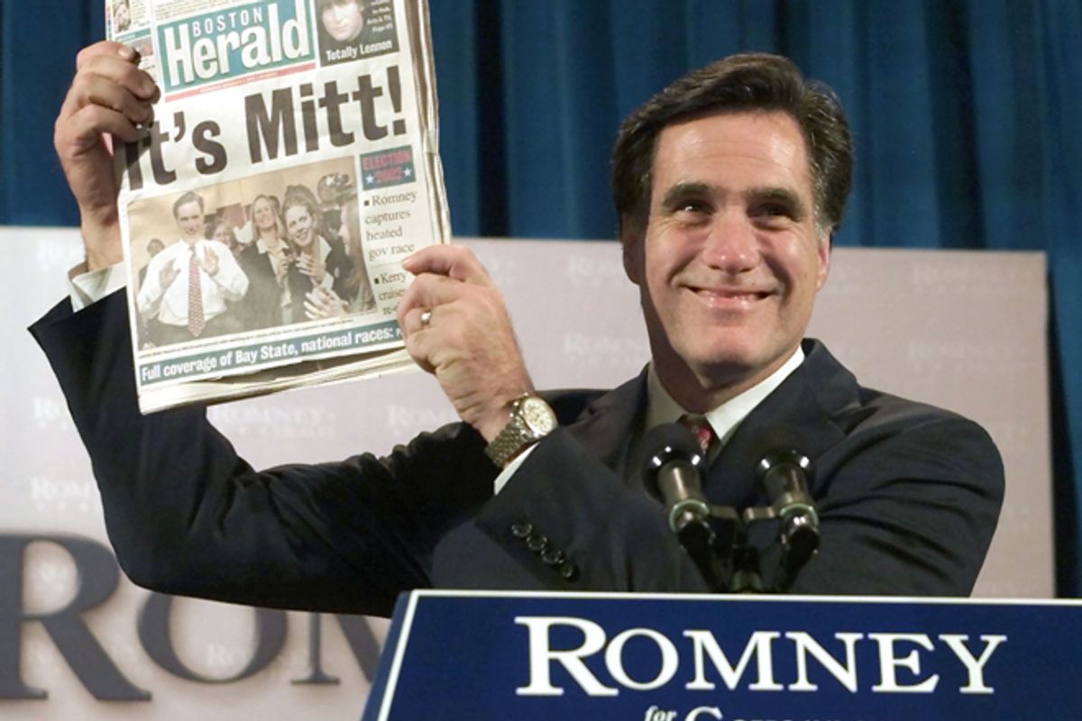 Mitt Romney holds up a Boston newspaper announcing his victory in the Massachusetts Governor's race in 2002.       (Reuters/Jim Bourg)