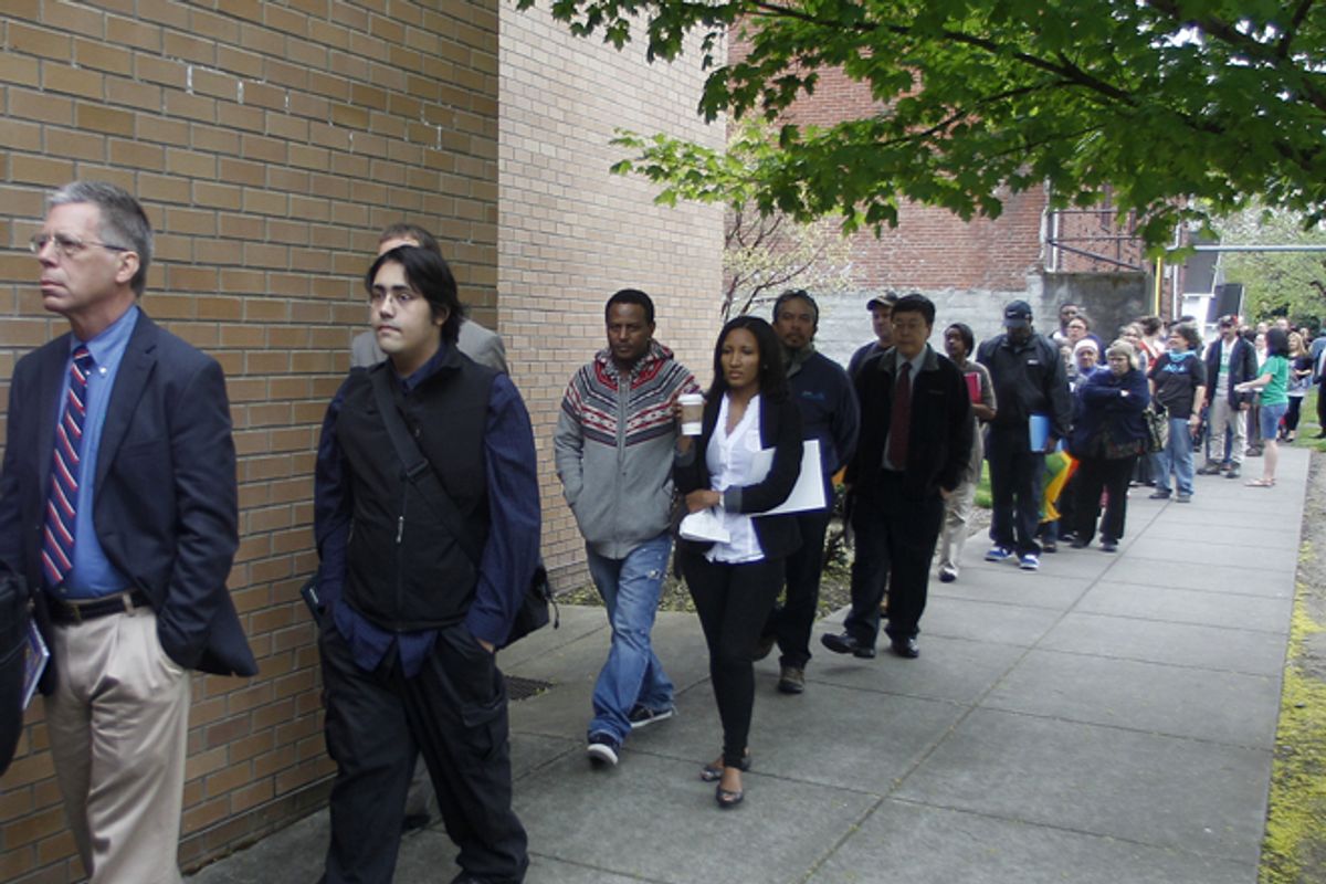 Job seekers wait in line during a job fair in Portland, Ore., on April 24.                                       (AP/Rick Bowmer)