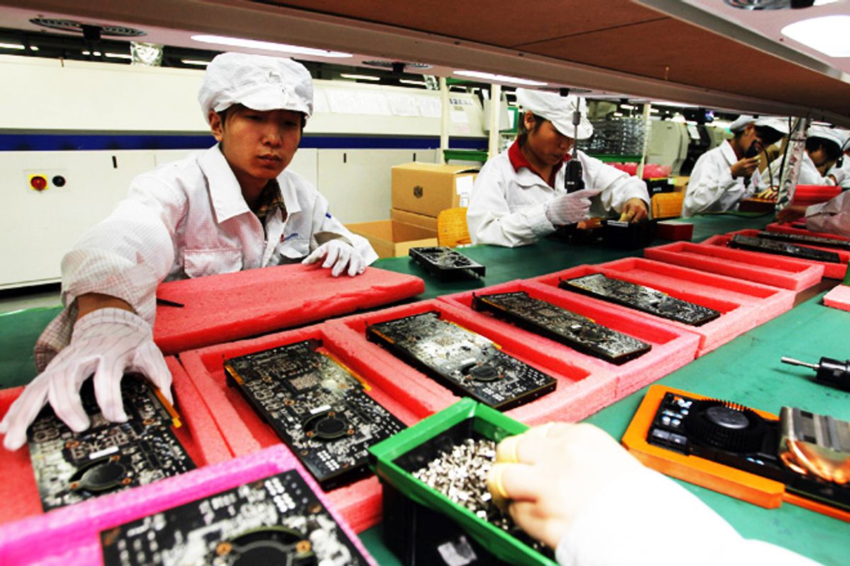 Staff members work on the production line at the Foxconn complex in Shenzhen, China.
          (AP/Kin Cheung)