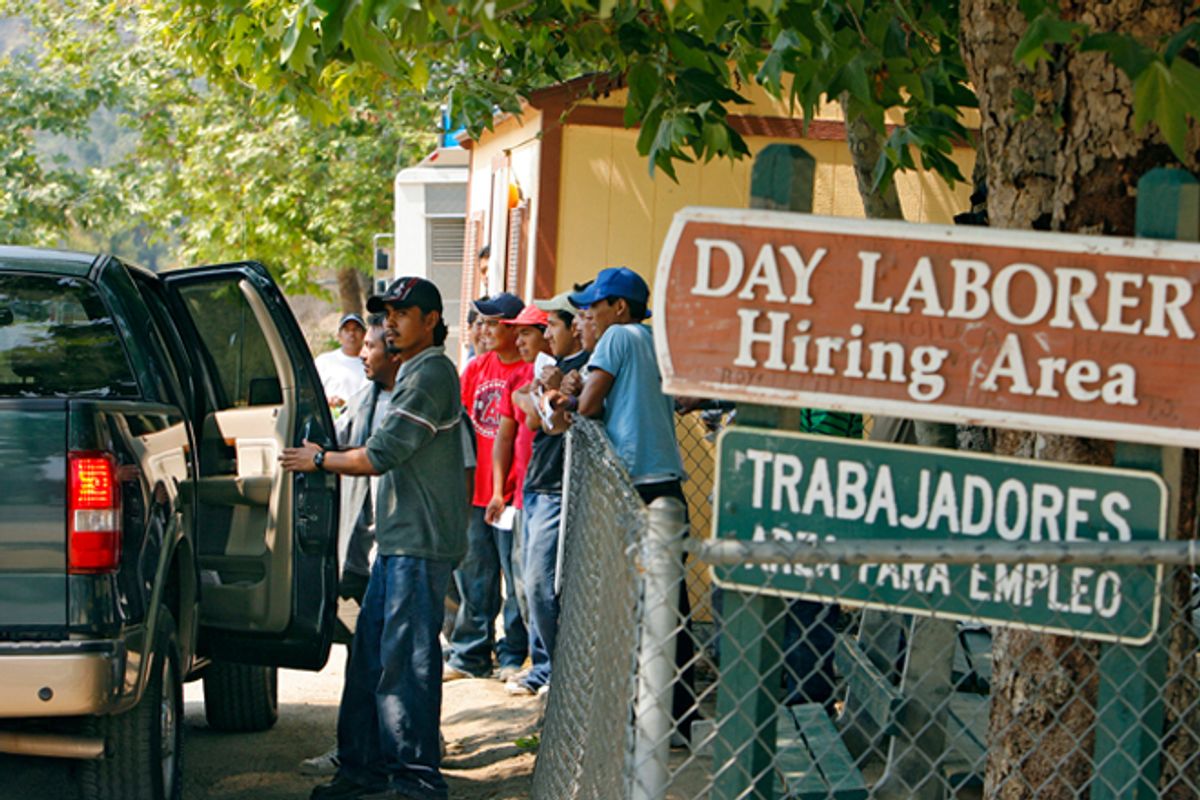 Day laborers enter a truck after being hired at a day labor hiring area in Laguna Beach, Calif.      (Reuters/Lucas Jackson)