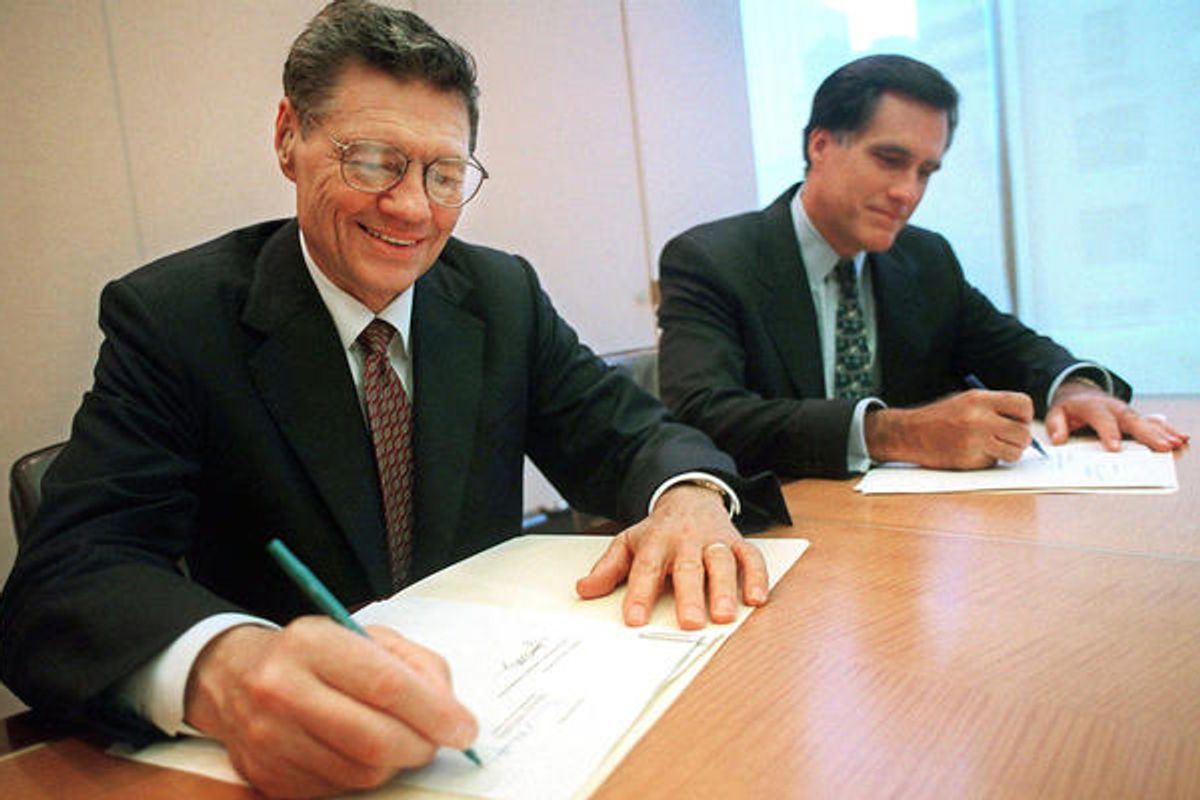 In this Sept. 25, 1998, file photo, Thomas S. Monaghan, founder and chairman of Domino's Pizza, Inc., left, and Mitt Romney sign an agreement.           (AP/Scott Gries)