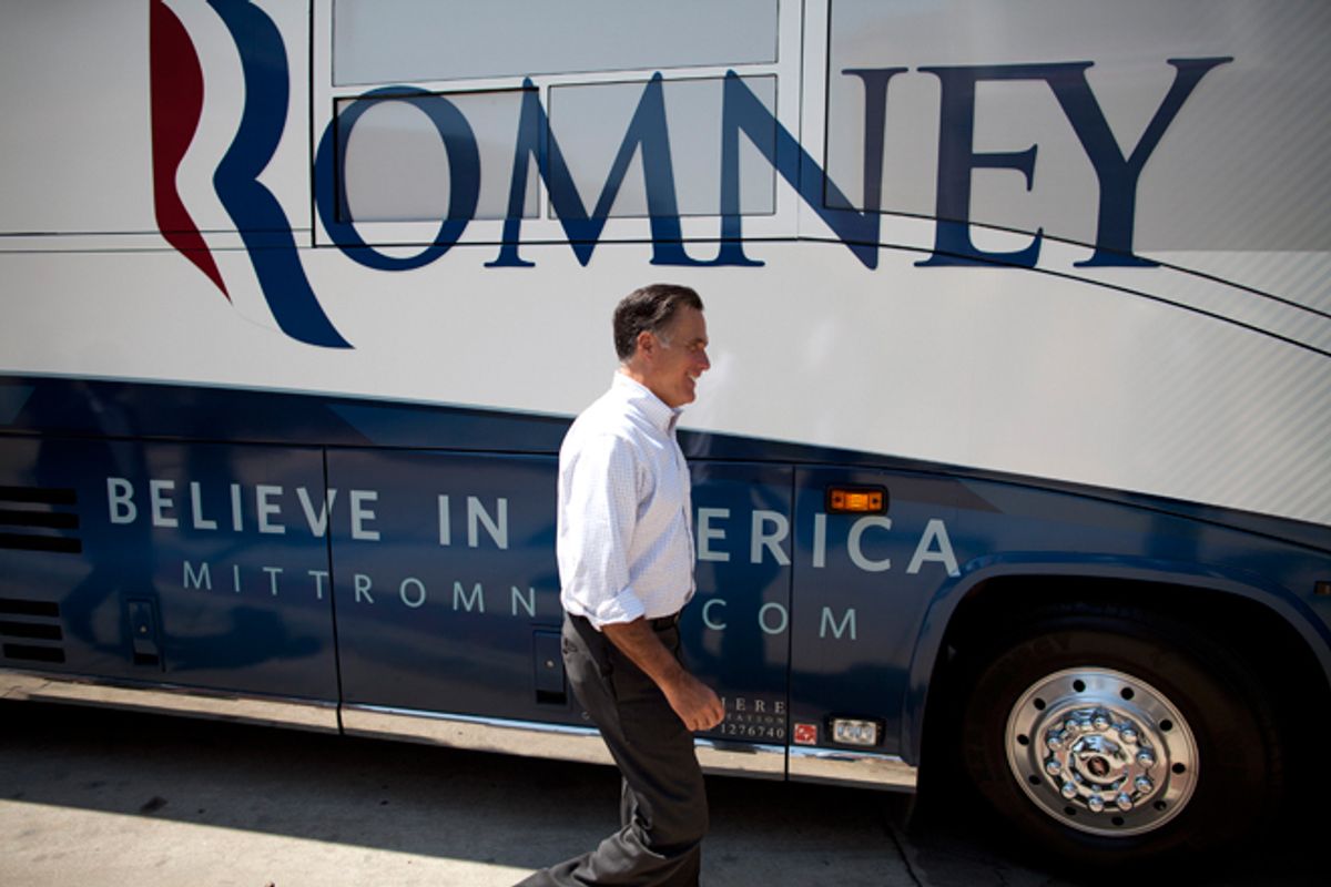 Mitt Romney in front of his campaign bus.      (AP/Evan Vucci)