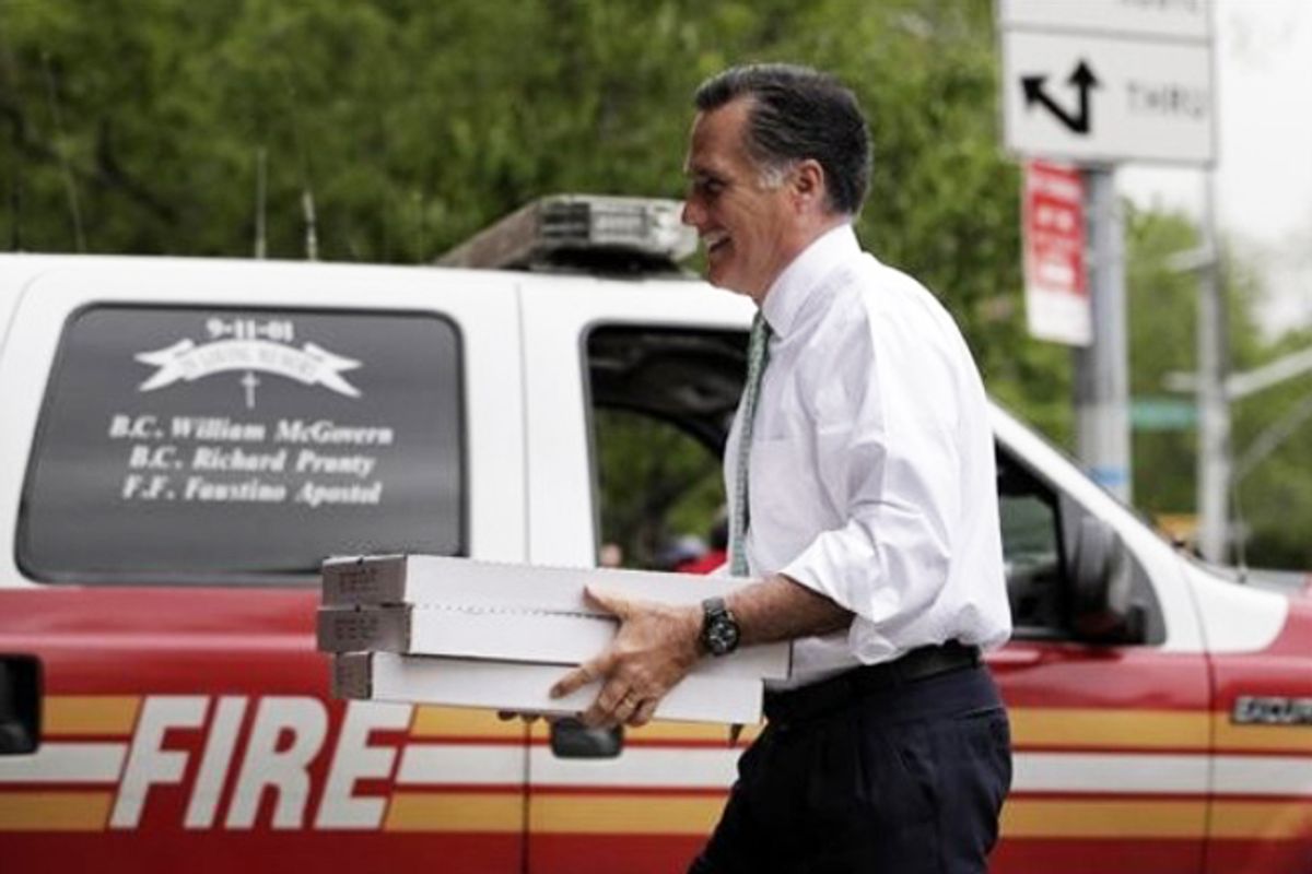 Mitt Romney carries boxes of pizza for firefighters at Engine 24, Ladder 5 in New York on May 1.        (AP/Jae C. Hong)