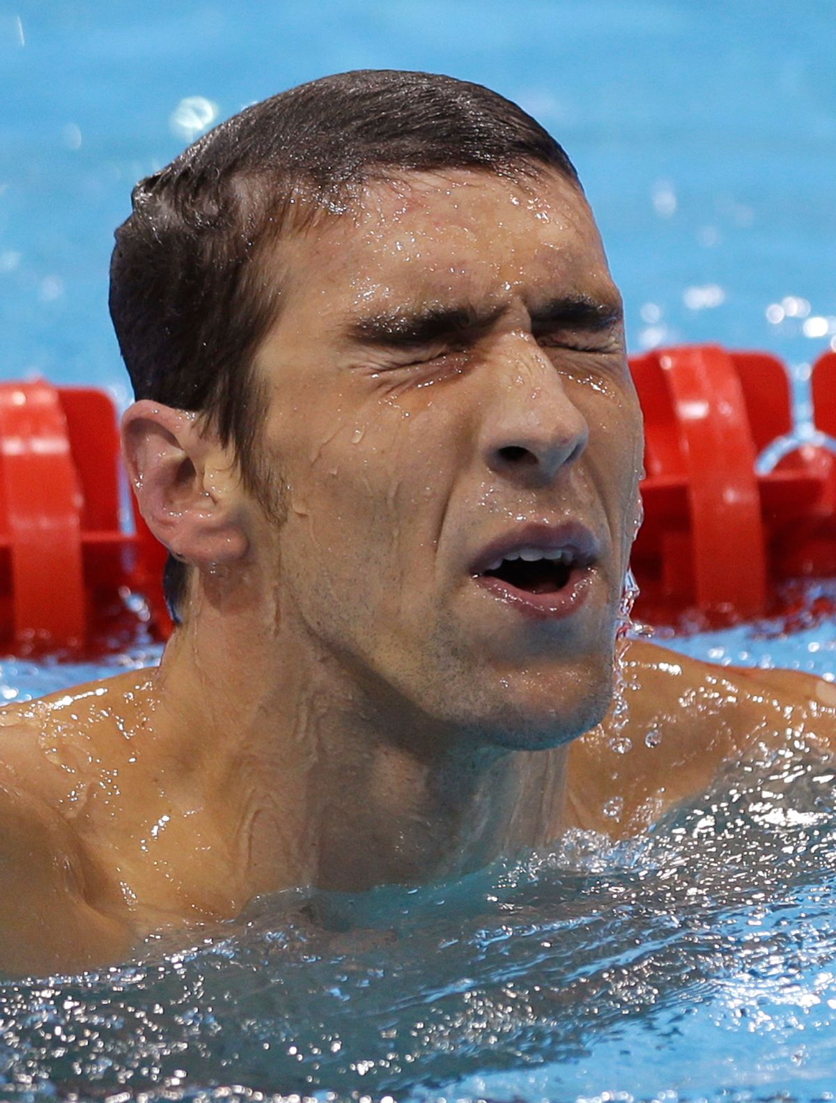 United States' Michael Phelps makes his way out of the pool after placing fourth in the men's 400-meter individual medley swimming final.    (AP/David J. Phillip)