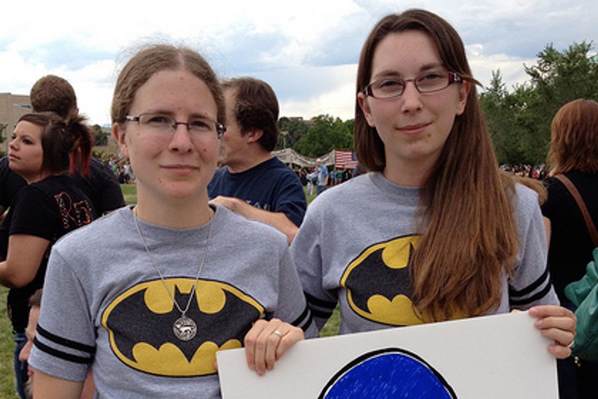 Kronda Seibert, left, and Jamie McCurdy participated in "Colorado Rises," a human chain demonstration       