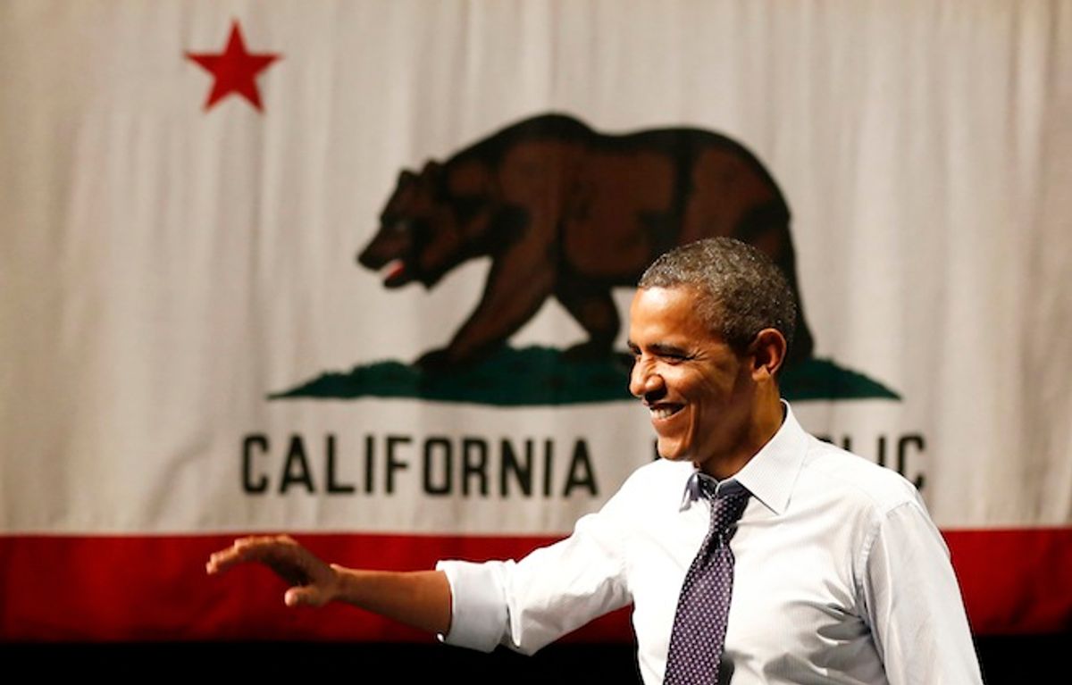 U.S. President Barack Obama waves before he speaks at a campaign event at the Fox Theatre Oakland in Oakland, July 23, 2012.              (Reuters/Larry Downing)