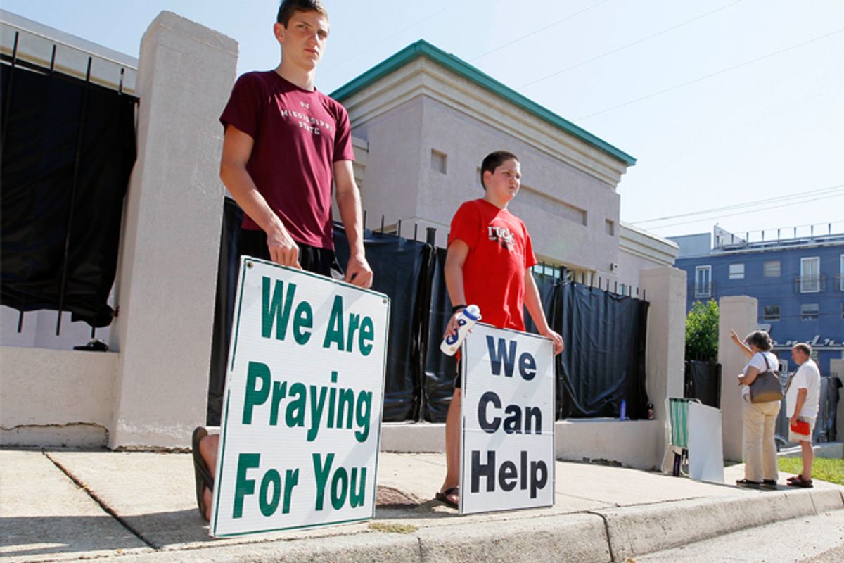 Anti-abortion advocates in Jackson stand outside Mississippi's only abortion clinic on June 27.        (AP/Rogelio V. Solis)