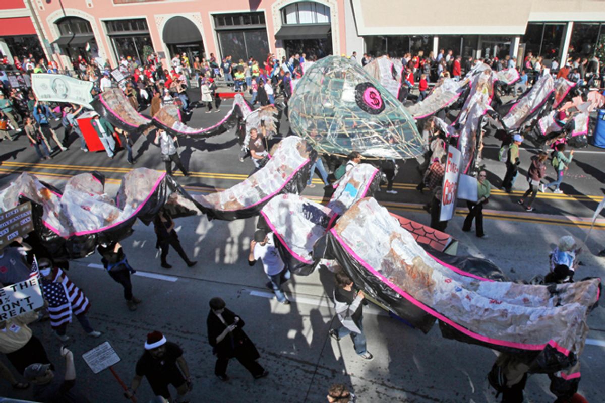 Occupy the Rose Parade protesters carry a large "corporate octopus" at the end of the Rose Parade in Pasadena, Calif., Jan. 2, 2012.     (AP/Reed Saxon)