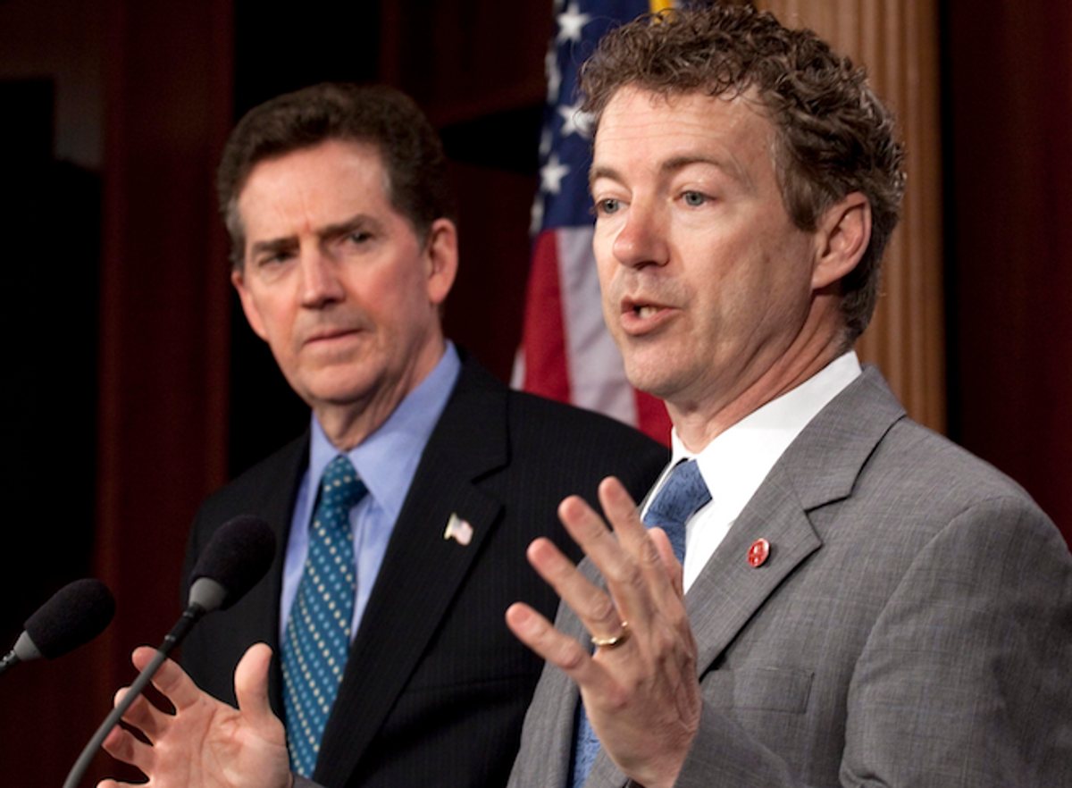 In a March 17, 2011 file photo, Sen. Rand Paul, R-Ky. speak at a news conference on the budget on Capitol Hill in Washington, as Sen. Jim DeMint, R-S.C., left, listens.     (AP/Harry Hamburg)
