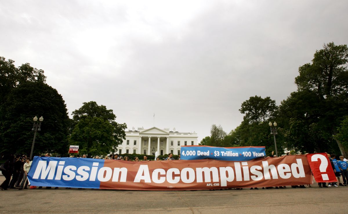 Demonstrators display a replica of "'Mission Accomplished" banner outside of the White House in Washington on Thursday, May 1, 2008.   (AP/Jose Luis Magana)