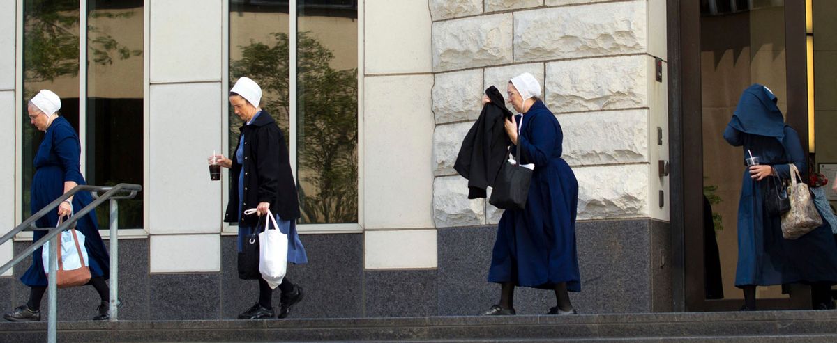 Amish women exit the U.S. Federal Courthouse in Cleveland on Thursday, Sept. 20, 2012.  The jury found all 16 Amish people guilty in the hair- and beard-cutting attacks against fellow Amish in Ohio. (AP Photo/Scott R. Galvin)   (Associated Press)