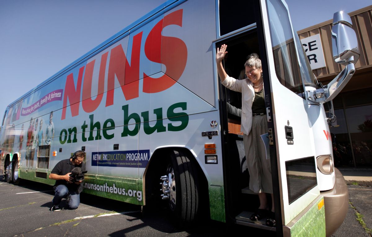 Sister Simone Campbell, executive director of Network, waves as she steps off the bus during a stop on the first day of a 9-state Nuns on the Bus tour, Monday, June 18, 2012, in Ames, Iowa. The group of Roman Catholic nuns say theyre not opposing any particular candidate but that their fight is with a Republican proposed federal budget they say hurts the poor and needy. (AP Photo/Charlie Neibergall)   (Associated Press)