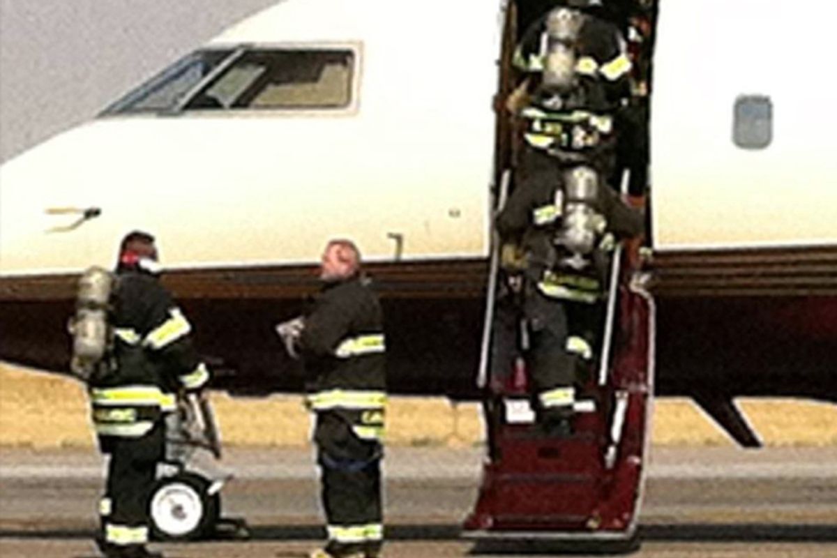 Firemen enter the plane carrying Ann Romney after the plane made an emergency landing in Denver on Friday.         (AP/Romney for President)