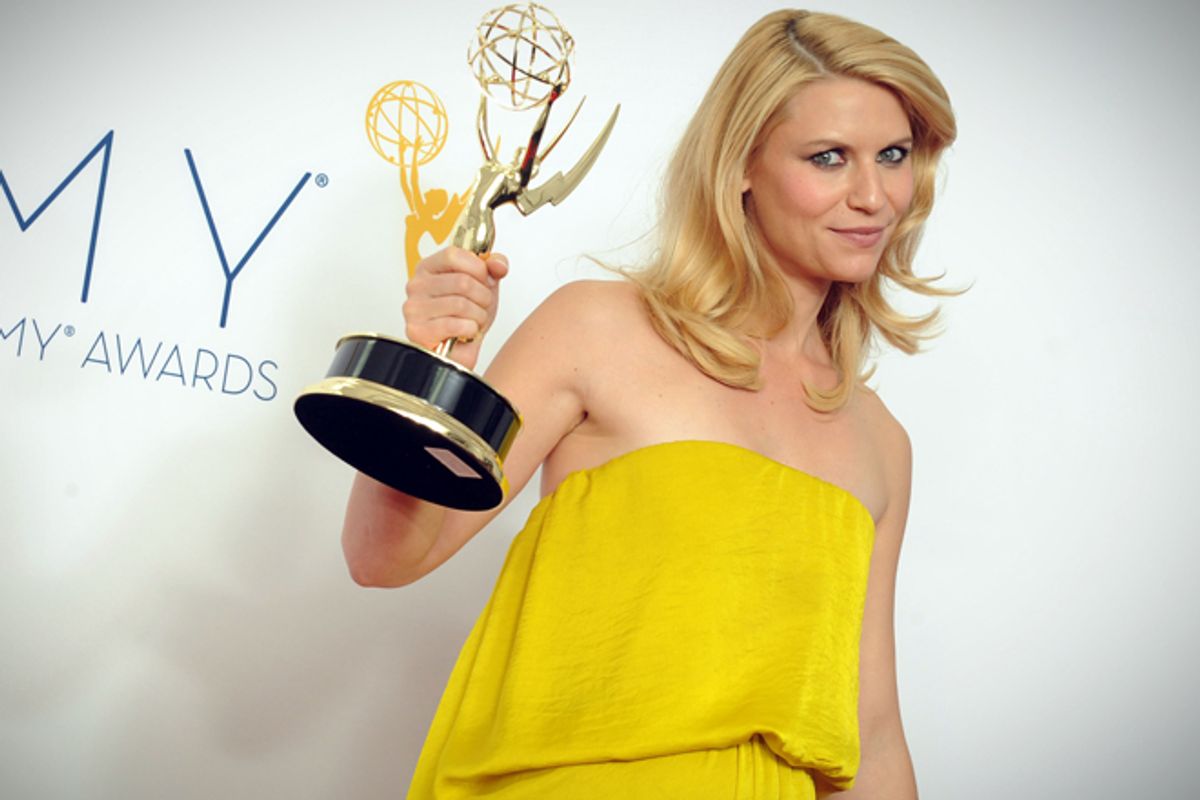 Actress Claire Danes, winner of the Outstanding Lead Actress In A Drama Series award for "Homeland," poses backstage at the 64th Primetime Emmy Awards at the Nokia Theatre on Sunday, Sept. 23, 2012, in Los Angeles.     (AP/Jordan Strauss)