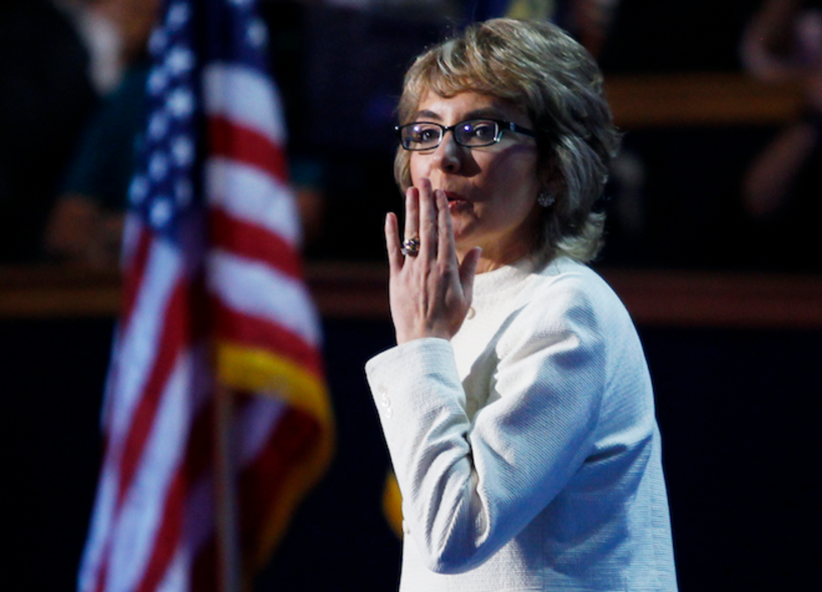  Former congresswoman Gabrielle Giffords blows a kiss after after Giffords led the convention in the U.S. Pledge of Allegiance during the final session of the Democratic National Convention in Charlotte, North Carolina September 6, 2012.     (Reuters/Jessica Rinaldi)
