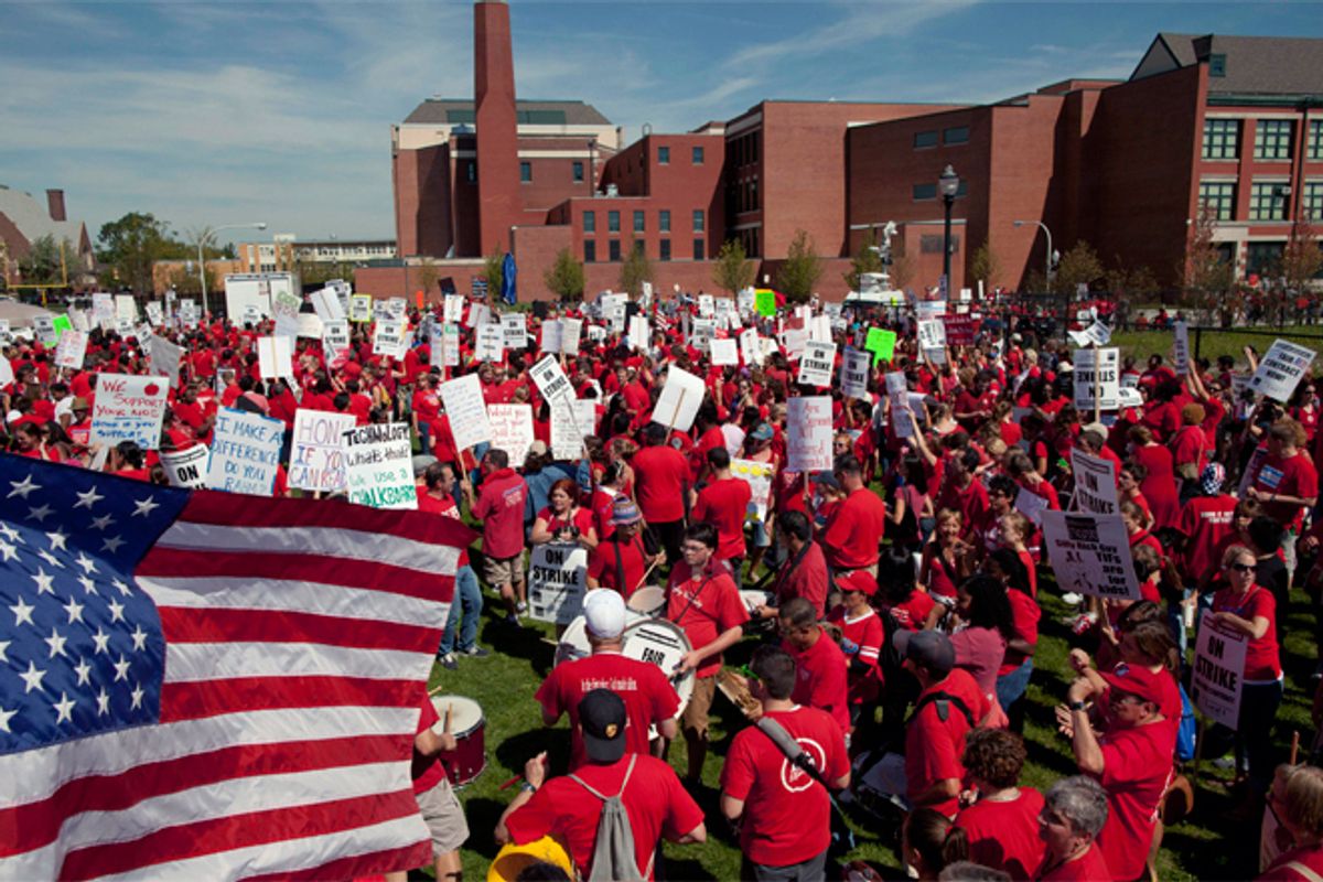 Public schoolteachers rally at John Marshall Metropolitan High School on  Sept. 12, 2012, in West Chicago.        (AP/Sitthixay Ditthavong)