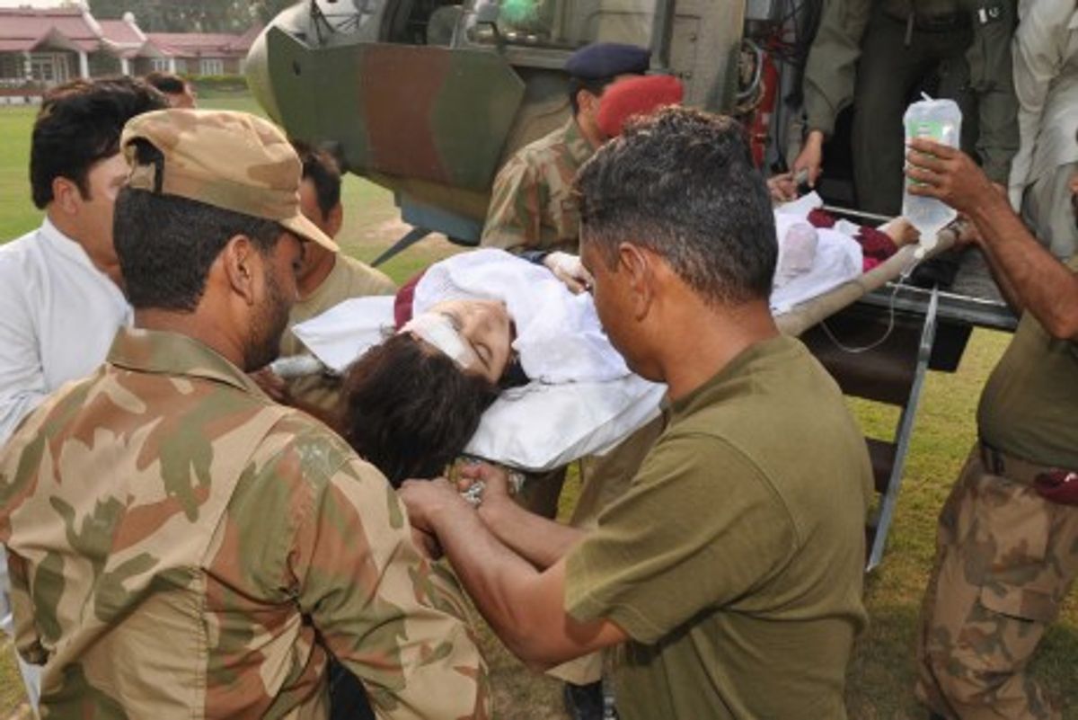 Pakistani soldiers carry wounded Malala Yousufzai, from a military helicopter (AP Photo)       