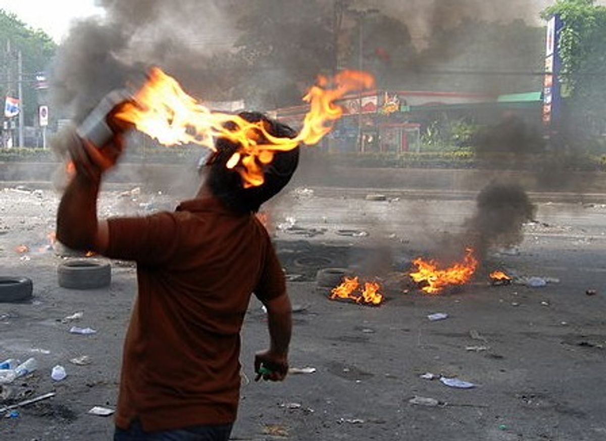 Man throws petrol bomb (Wikimedia) 